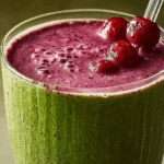 Berry Green Tea Smoothie in a glass with fresh berries and mint