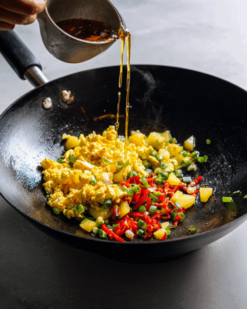 Spoonful of Thai Pineapple Fried Rice with pineapple chunks