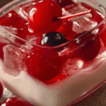 Thai Red Rubies Dessert with coconut milk and jackfruit in a glass bowl