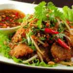 Crispy Catfish and Green Mango Salad served on Thai-style plate