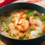 Thai Breakfast Rice Soup with Shrimp in a Thai ceramic bowl