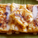 Thai Roti with Sweetened Condensed Milk being cooked by a Thai street vendor
