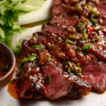 Crying Tiger Beef served with sticky rice and dipping sauce.