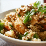 Thai Chicken and Quinoa Bowl with Roasted Vegetables in natural light
