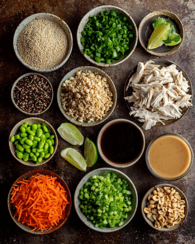 Whisking Thai peanut sauce for chicken quinoa bowl