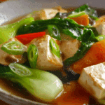 Clear Soup with Tofu and Vegetables served hot in a bowl
