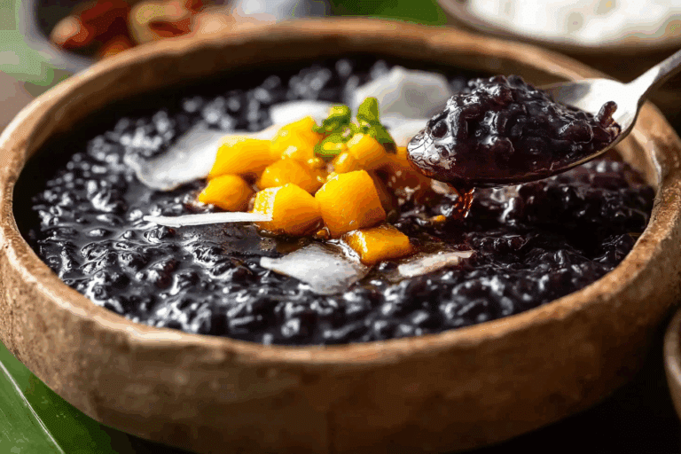 Thai Black Sticky Rice Pudding served with coconut cream and mango