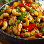 Chicken Stir-Fry with Cashew Egg Mix served on jasmine rice.