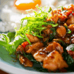 Thai Chicken with Holy Basil and Egg served with rice and fried egg