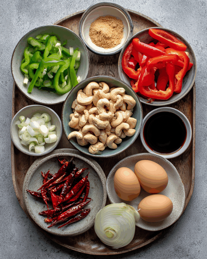 Ingredients for Chicken Stir-Fry with Cashew Egg Mix on a kitchen counter.
