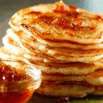 Fluffy Thai Rice Flour Pancakes with Palm Sugar stacked with syrup drizzle