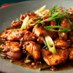 Easy Chili Garlic Chicken served with jasmine rice and herbs