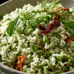 Fresh Herb Rice Salad served in a bowl with pistachios and herbs