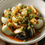 Authentic preserved egg salad served with garlic and peppers