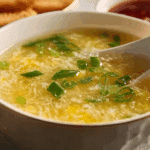 Golden homemade Egg Drop Soup served hot with scallions.