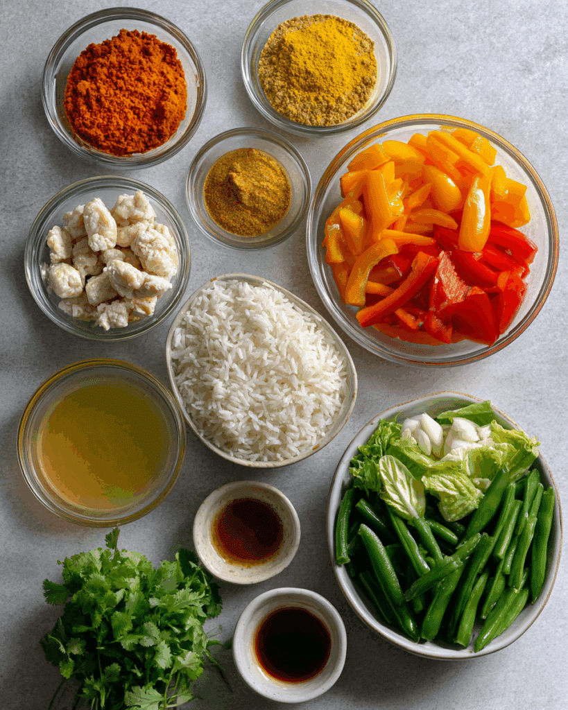 Ingredients for Thai Curry Fried Rice arranged neatly on a table.