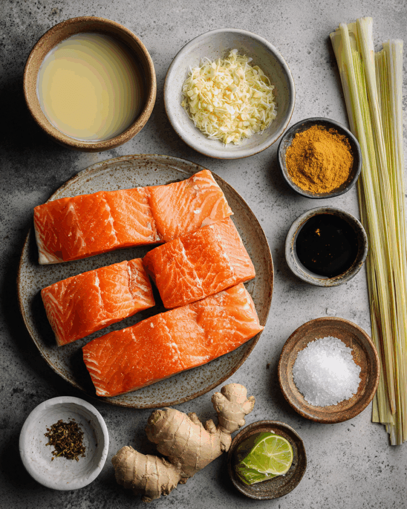 Ingredients for Poached Salmon in Coconut Lime Sauce arranged on a kitchen table.