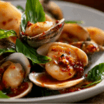 Clams with Roasted Chili Paste and Basil served with Thai basil and rice.