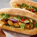 Chicken Satay Sandwich with peanut sauce and pickled vegetables.