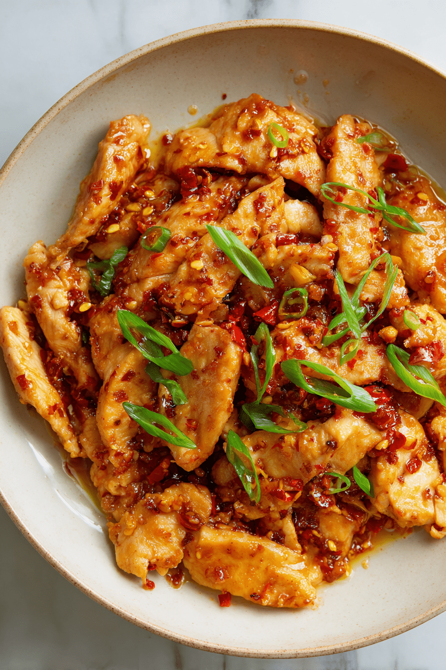 Easy Chili Garlic Chicken served with jasmine rice and herbs