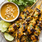 Thai Chicken Satay with Peanut Sauce served with lime wedges