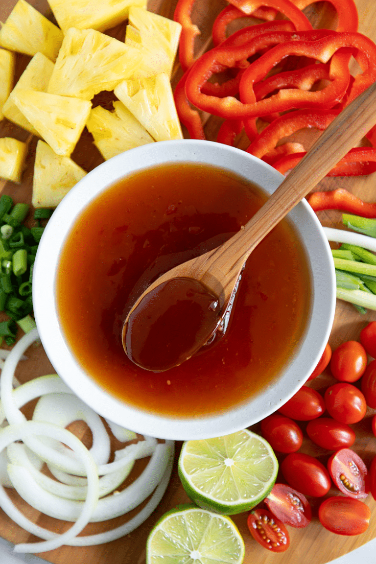 Homemade sweet and sour sauce for stir fry in a bowl with glossy texture