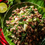 authentic thai beef larb recipe served with fresh herbs